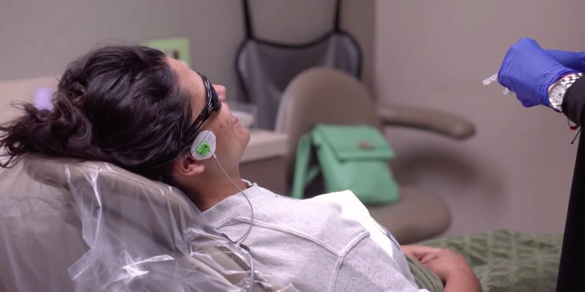 Woman flossing her teeth