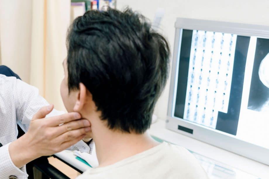 dentist examining a patient's jaw