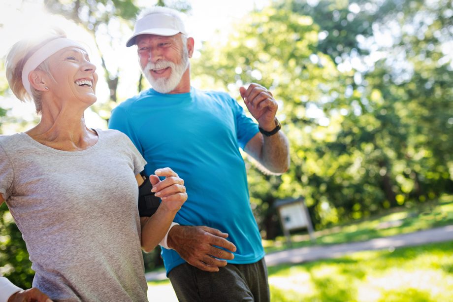 senior couple jogging outside